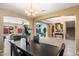 Open-concept dining area with modern chandelier, seamlessly connecting to the home's main living spaces at 2901 E Iris Dr, Chandler, AZ 85286