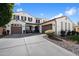 Elegant two-story home featuring a three-car garage, manicured landscaping, and a welcoming entrance at 2901 E Iris Dr, Chandler, AZ 85286