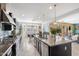 Open kitchen featuring a large island, stainless steel appliances, and a breakfast nook with ample natural light at 2901 E Iris Dr, Chandler, AZ 85286