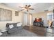 Inviting living room with neutral tones, a ceiling fan, and a comfortable gray sofa at 2901 E Iris Dr, Chandler, AZ 85286