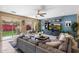 Comfortable living room with sliding glass doors to the backyard and modern entertainment center at 2901 E Iris Dr, Chandler, AZ 85286