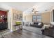Spacious loft with a ceiling fan, modern furniture, and a view of the staircase at 2901 E Iris Dr, Chandler, AZ 85286