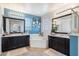 Open main bathroom featuring dual vanities, a soaking tub, and a serene, well-lit space at 2901 E Iris Dr, Chandler, AZ 85286