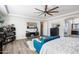 Comfortable main bedroom with a ceiling fan, a sitting area, and modern decor elements at 2901 E Iris Dr, Chandler, AZ 85286