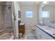 Bathroom with a combination tub/shower, neutral tiling, and white vanity sink at 3137 E Maryland Ave, Phoenix, AZ 85016