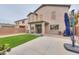 Backyard featuring artificial turf, concrete patio and view of the home's rear exterior at 35598 N Murray Grey Dr, San Tan Valley, AZ 85143