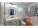 Modern bathroom features a sleek white vanity, patterned shower curtain, and updated fixtures at 35598 N Murray Grey Dr, San Tan Valley, AZ 85143