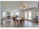 This naturally lit dining room features hardwood floors and views into the kitchen and living room at 35598 N Murray Grey Dr, San Tan Valley, AZ 85143