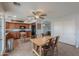 This open kitchen flows into the dining room and features wood cabinets and modern appliances at 35598 N Murray Grey Dr, San Tan Valley, AZ 85143