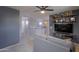 Upstairs living area featuring a cozy couch and a custom media center and shelving system at 35598 N Murray Grey Dr, San Tan Valley, AZ 85143