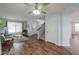 The living room features hardwood floors, access to the stairs, and a white front door at 35598 N Murray Grey Dr, San Tan Valley, AZ 85143