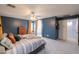 Bright main bedroom featuring ceiling fan, and en suite bathroom at 35598 N Murray Grey Dr, San Tan Valley, AZ 85143