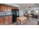 View of the kitchen flowing into the open-concept dining and living area, creating a unified space at 35598 N Murray Grey Dr, San Tan Valley, AZ 85143