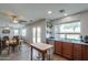 Bright open-concept area highlights the seamless connection between the kitchen, dining, and living spaces at 35598 N Murray Grey Dr, San Tan Valley, AZ 85143
