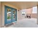 Covered patio with double doors leading inside, BBQ grill, and views of the backyard at 35598 N Murray Grey Dr, San Tan Valley, AZ 85143