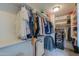 Walk-in closet with clothes racks, shelves, personal items, and organized storage solutions at 35598 N Murray Grey Dr, San Tan Valley, AZ 85143