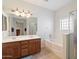 Bathroom with double sinks, soaking tub and shower at 3703 E Mitchell Dr, Phoenix, AZ 85018