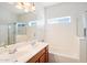 Bathroom features double vanity, bathtub, and shower at 3703 E Mitchell Dr, Phoenix, AZ 85018