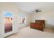 Bedroom with wood bed frame and access to a balcony at 3703 E Mitchell Dr, Phoenix, AZ 85018