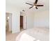 Bright bedroom with ceiling fan and access to bathroom at 3703 E Mitchell Dr, Phoenix, AZ 85018