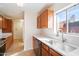 Modern kitchen with stainless steel appliances and wood cabinets at 3703 E Mitchell Dr, Phoenix, AZ 85018
