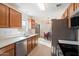 Eat-in kitchen with stainless steel appliances and wood cabinets at 3703 E Mitchell Dr, Phoenix, AZ 85018
