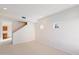 Spacious living room with neutral carpet and stairway at 3703 E Mitchell Dr, Phoenix, AZ 85018