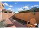 Private patio with brick pavers and seating area at 3703 E Mitchell Dr, Phoenix, AZ 85018