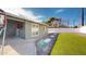 Landscaped backyard with artificial turf and basketball hoop at 3714 E Amelia Ave, Phoenix, AZ 85018