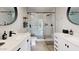 Modern bathroom with a walk-in shower and double vanity at 3714 E Amelia Ave, Phoenix, AZ 85018