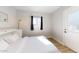 Bright bedroom with a queen bed and direct access to exterior at 3714 E Amelia Ave, Phoenix, AZ 85018