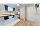 Cozy bedroom with a bunk bed, window, and light wood floors at 3714 E Amelia Ave, Phoenix, AZ 85018