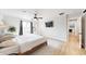 Main bedroom with wooden bed frame and ensuite bathroom at 3714 E Amelia Ave, Phoenix, AZ 85018