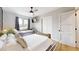 Main bedroom with two beds, ceiling fan, and window at 3714 E Amelia Ave, Phoenix, AZ 85018