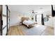 Spacious bedroom with a king bed and barn door at 3714 E Amelia Ave, Phoenix, AZ 85018