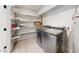 Bright laundry room, washer, dryer, and ample shelving at 3714 E Amelia Ave, Phoenix, AZ 85018