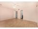 Spacious bedroom with light flooring and ceiling fan at 4511 W Sandra Ter, Glendale, AZ 85306