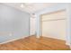 Bedroom with wood-look floors and spacious closet at 4511 W Sandra Ter, Glendale, AZ 85306