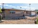 Brick ranch house with a two-car garage and landscaped yard at 4511 W Sandra Ter, Glendale, AZ 85306