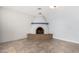 Close-up view of a unique, curved brick fireplace at 4511 W Sandra Ter, Glendale, AZ 85306