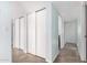 Hallway with tiled floors and multiple closets at 4511 W Sandra Ter, Glendale, AZ 85306