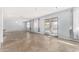 Open concept living space with tile floors and access to a patio and pool at 4511 W Sandra Ter, Glendale, AZ 85306