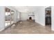 Spacious living area with tile floors and French doors leading to the backyard at 4511 W Sandra Ter, Glendale, AZ 85306