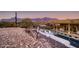 Property boasts a beautiful pool and patio, overlooking stunning mountain views at 4590 S Gold Canyon Dr, Gold Canyon, AZ 85118