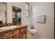 Well-appointed bathroom with marble vanity, a shower, and toilet at 4590 S Gold Canyon Dr, Gold Canyon, AZ 85118