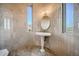 Elegant bathroom with pedestal sink, tiled walls, and mountain views at 4590 S Gold Canyon Dr, Gold Canyon, AZ 85118