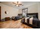 Bedroom with two twin beds, hardwood floors, and a ceiling fan at 4590 S Gold Canyon Dr, Gold Canyon, AZ 85118
