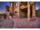 View of the home's entrance with brick pavers and desert landscaping at 4590 S Gold Canyon Dr, Gold Canyon, AZ 85118
