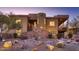 Stunning desert contemporary home with a large covered patio and beautiful landscaping at 4590 S Gold Canyon Dr, Gold Canyon, AZ 85118