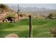 Golf course with putting green and saguaro cacti at 4590 S Gold Canyon Dr, Gold Canyon, AZ 85118